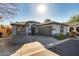 Inviting single-story home featuring a classic design, two-car garage, desert landscaping, and easy street access at 2145 E Danbury Rd, Phoenix, AZ 85022