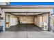 Spacious two-car garage with ample storage cabinets, shelving units, and built-in utility sink at 2145 E Danbury Rd, Phoenix, AZ 85022