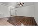 Open living room featuring hard wood floors, white walls, and ceiling fan at 2145 E Danbury Rd, Phoenix, AZ 85022