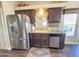 Modern kitchen featuring stainless steel appliances, dark wood cabinets, and ample counter space at 2291 S Seminole Dr, Apache Junction, AZ 85119