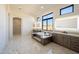 Elegant bathroom with a soaking tub, dual sinks, and marble flooring for a spa-like retreat at 23964 N 128Th Pl, Scottsdale, AZ 85255