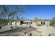 Mediterranean-style home with desert landscaping and three-car garage at 23964 N 128Th Pl, Scottsdale, AZ 85255