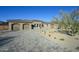 Beautiful home with a paver driveway and lush desert landscaping at 23964 N 128Th Pl, Scottsdale, AZ 85255