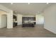 Spacious kitchen area with dark cabinetry, center island, and stainless steel appliances at 23964 N 128Th Pl, Scottsdale, AZ 85255