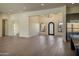 Open-concept home featuring a spacious living room and decorative iron doorway at 23964 N 128Th Pl, Scottsdale, AZ 85255