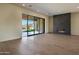 Expansive living room with a modern fireplace and seamless indoor-outdoor living at 23964 N 128Th Pl, Scottsdale, AZ 85255