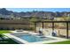 Stunning pool with travertine tile and mountain views create a luxurious outdoor oasis at 23964 N 128Th Pl, Scottsdale, AZ 85255