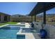 Inviting backyard oasis with a pool, spa, fire pit, and pergola, perfect for entertaining at 23964 N 128Th Pl, Scottsdale, AZ 85255
