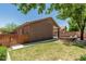 Well-maintained backyard with green grass and a wooden fence providing privacy and security at 2444 S Terrell --, Mesa, AZ 85209