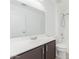 Updated bathroom with dark brown cabinets, white countertop and shower at 2444 S Terrell --, Mesa, AZ 85209