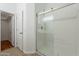 Modern bathroom featuring a glass-enclosed shower and a walk-in closet at 2444 S Terrell --, Mesa, AZ 85209
