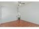 Cozy bedroom with hardwood floors and a ceiling fan, offering a comfortable retreat at 2444 S Terrell --, Mesa, AZ 85209