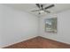 Bedroom with hardwood floors, ceiling fan, window and neutral color palette at 2444 S Terrell --, Mesa, AZ 85209