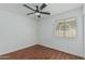 Bedroom with hardwood floors, ceiling fan, window and neutral color palette at 2444 S Terrell --, Mesa, AZ 85209