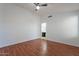 Generously sized bedroom featuring hard floors, a ceiling fan, and easy bathroom access at 2444 S Terrell --, Mesa, AZ 85209