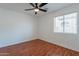 Bedroom featuring a ceiling fan, wood-look flooring and a window at 2444 S Terrell --, Mesa, AZ 85209