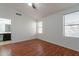 Spacious bedroom with wood floors and neutral walls, ready for personalization at 2444 S Terrell --, Mesa, AZ 85209