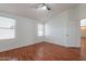 Cozy bedroom with wood floors, a ceiling fan, and natural light at 2444 S Terrell --, Mesa, AZ 85209