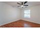 Bright bedroom featuring a ceiling fan, wood-look flooring and a window at 2444 S Terrell --, Mesa, AZ 85209