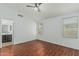 Inviting bedroom featuring wood floors, a ceiling fan and two windows, providing comfort and natural light at 2444 S Terrell --, Mesa, AZ 85209