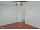 Bedroom with hardwood floors, ceiling fan, and neutral color palette at 2444 S Terrell --, Mesa, AZ 85209