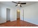 Bedroom featuring a ceiling fan, wood-look flooring and a closet at 2444 S Terrell --, Mesa, AZ 85209