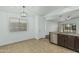 Bright dining area with a window, stylish light fixture and easy access to the kitchen at 2444 S Terrell --, Mesa, AZ 85209