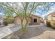 Attractive exterior of single-Gathering home with desert landscaping, two-car garage, and neutral paint scheme at 2444 S Terrell --, Mesa, AZ 85209