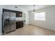 Eat-in kitchen area featuring stainless steel appliances, ample storage, and tile flooring at 2444 S Terrell --, Mesa, AZ 85209