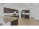 Bright kitchen featuring stainless steel appliances, dark cabinetry, and a functional layout at 2444 S Terrell --, Mesa, AZ 85209