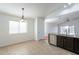 Charming kitchen with tile floors, stainless steel appliances, breakfast bar, and ample natural light at 2444 S Terrell --, Mesa, AZ 85209
