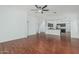Open living area with hardwood floors, ceiling fan and easy access to the kitchen, perfect for entertaining at 2444 S Terrell --, Mesa, AZ 85209