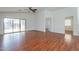 Spacious living room featuring wood floors, neutral walls, and seamless access to other living spaces at 2444 S Terrell --, Mesa, AZ 85209