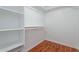 Spacious walk-in closet with shelving and wooden floors offer ample storage at 2444 S Terrell --, Mesa, AZ 85209
