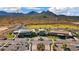 A scenic aerial view of the community center, nestled in a desert landscape with golf and mountain views at 26761 W Escuda Dr, Buckeye, AZ 85396