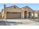 Charming single-story home featuring a two-car garage and inviting desert landscaping at 26761 W Escuda Dr, Buckeye, AZ 85396