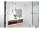 Modern bathroom with sleek vanity, minimalist fixtures, and glass-enclosed shower at 3106 N Valencia Ln, Phoenix, AZ 85018