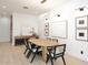 Bright dining room featuring modern decor, a wooden table and hardwood flooring at 3106 N Valencia Ln, Phoenix, AZ 85018