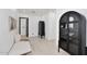 Bright hallway with modern decor, light wood floors, and stylish display cabinets at 3106 N Valencia Ln, Phoenix, AZ 85018
