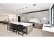Gourmet kitchen featuring a large marble island, stainless appliances, and pendant lighting at 3106 N Valencia Ln, Phoenix, AZ 85018