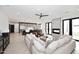 Expansive living space featuring a fireplace, open kitchen, and elegant hardwood floors at 3106 N Valencia Ln, Phoenix, AZ 85018