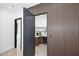Modern pantry with wood slat accent wall, wine cooler, light countertops, and custom cabinetry at 3106 N Valencia Ln, Phoenix, AZ 85018