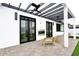 Outdoor patio area with a pergola, ceiling fans, a fireplace, and comfortable seating at 3106 N Valencia Ln, Phoenix, AZ 85018
