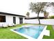 Inviting backyard pool with artificial turf offers a modern and relaxing outdoor space at 3106 N Valencia Ln, Phoenix, AZ 85018
