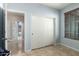The bedroom shows an accessible closet and a window with wood blinds at 36579 W Barcelona Ln, Maricopa, AZ 85138