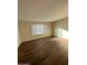 A spacious bedroom with lots of natural light and modern flooring at 3810 W Belmont Ave, Phoenix, AZ 85051