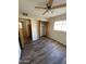 Bedroom with ceiling fan, closet and wood-look vinyl flooring at 3810 W Belmont Ave, Phoenix, AZ 85051