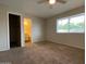Spacious bedroom with natural light and carpet flooring at 3810 W Belmont Ave, Phoenix, AZ 85051
