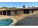Exterior view of home with in-ground pool and gravel landscaping at 3810 W Belmont Ave, Phoenix, AZ 85051