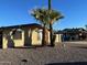 Attractive single-story home with desert landscaping, blue trim, and a large window at 3810 W Belmont Ave, Phoenix, AZ 85051